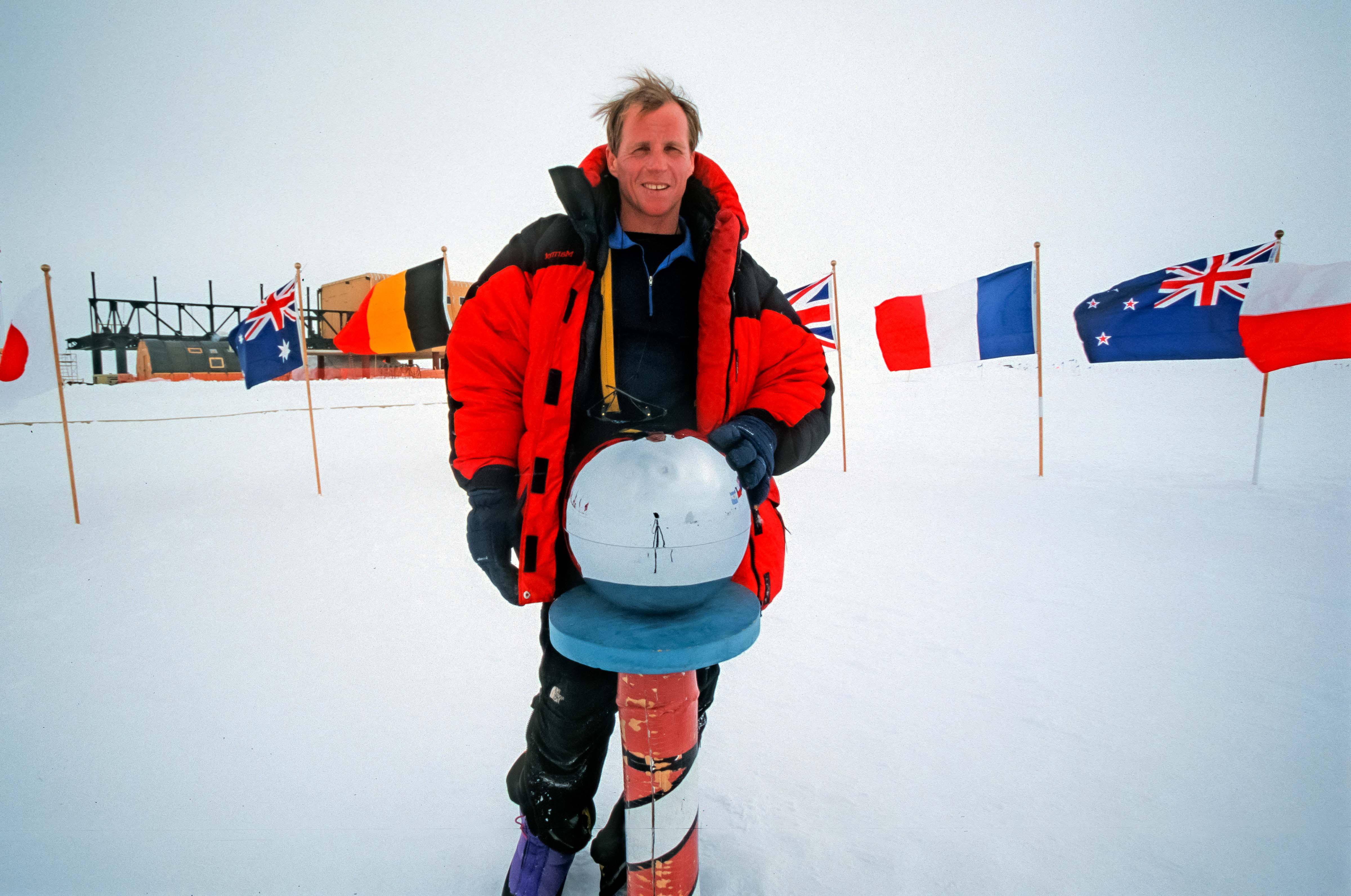 Antarctica, Jeff Shea at South Pole with Globe, 2001