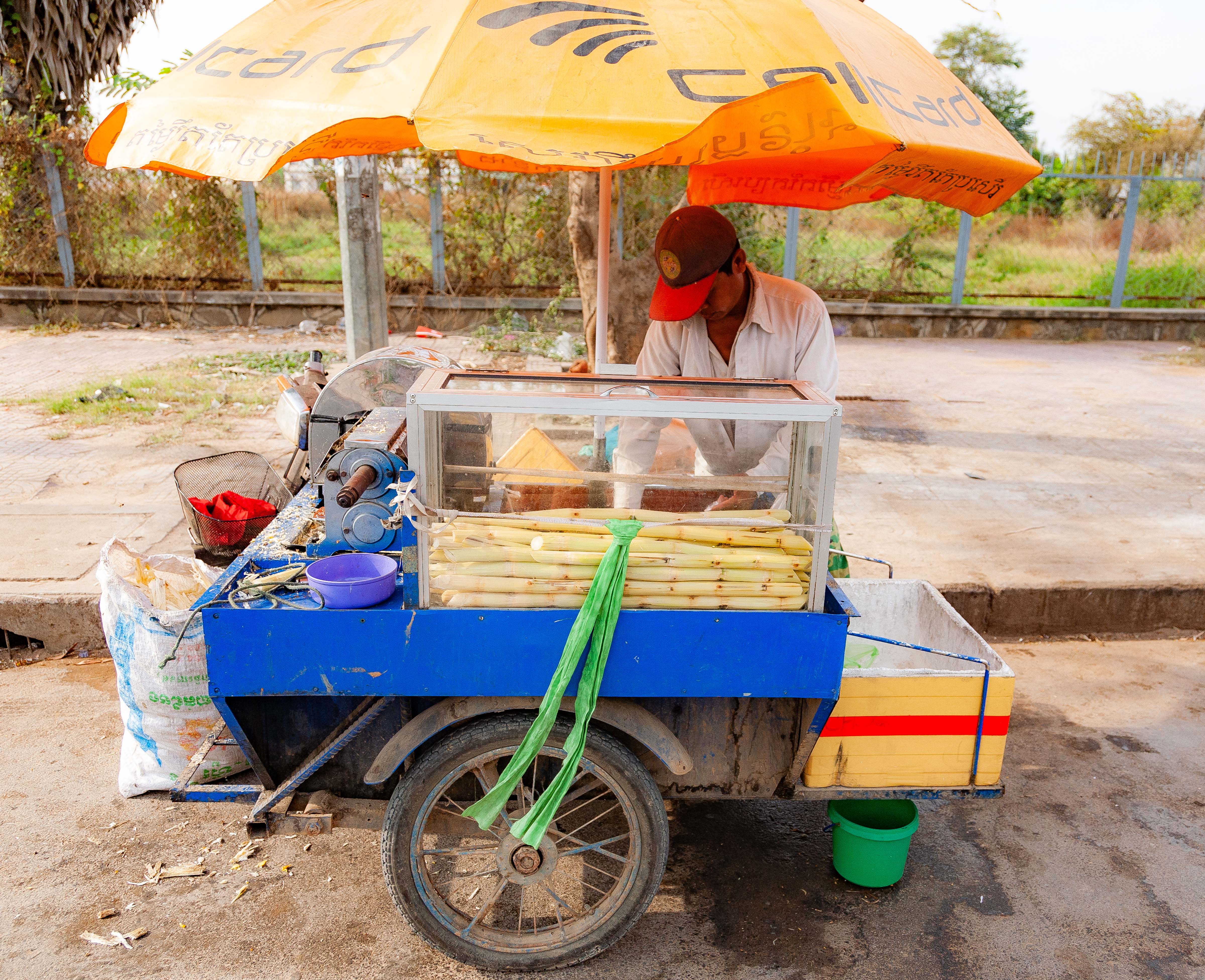 Cambodia, Phnom Penh Prov, Sugar Cane Juice Vendor, 2010, IMG 4577