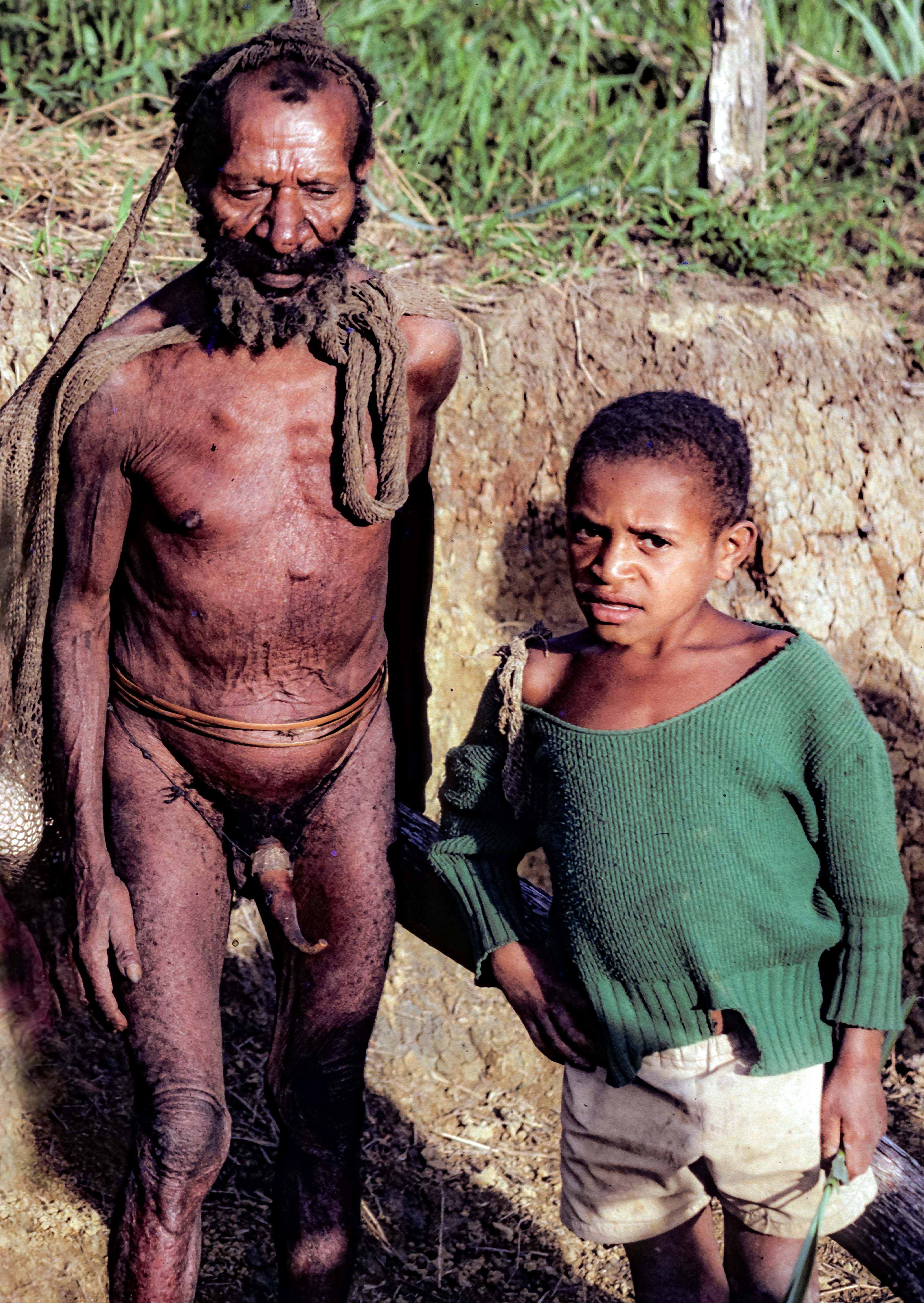 PNG, Oksapmin Man With Penis Gourd And Boy, 1983
