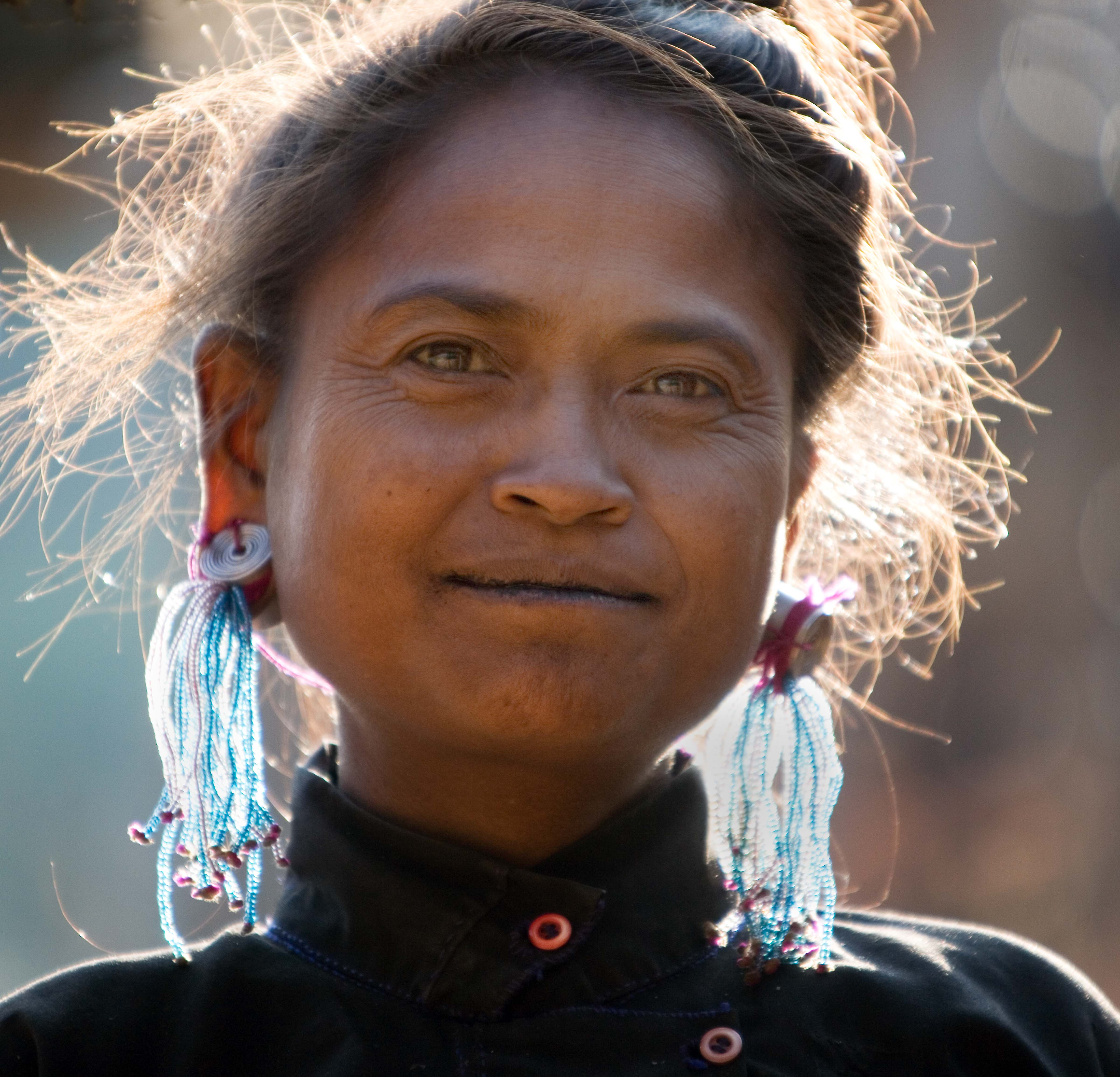 Eng Woman with Glass Bead Earrings in Sun