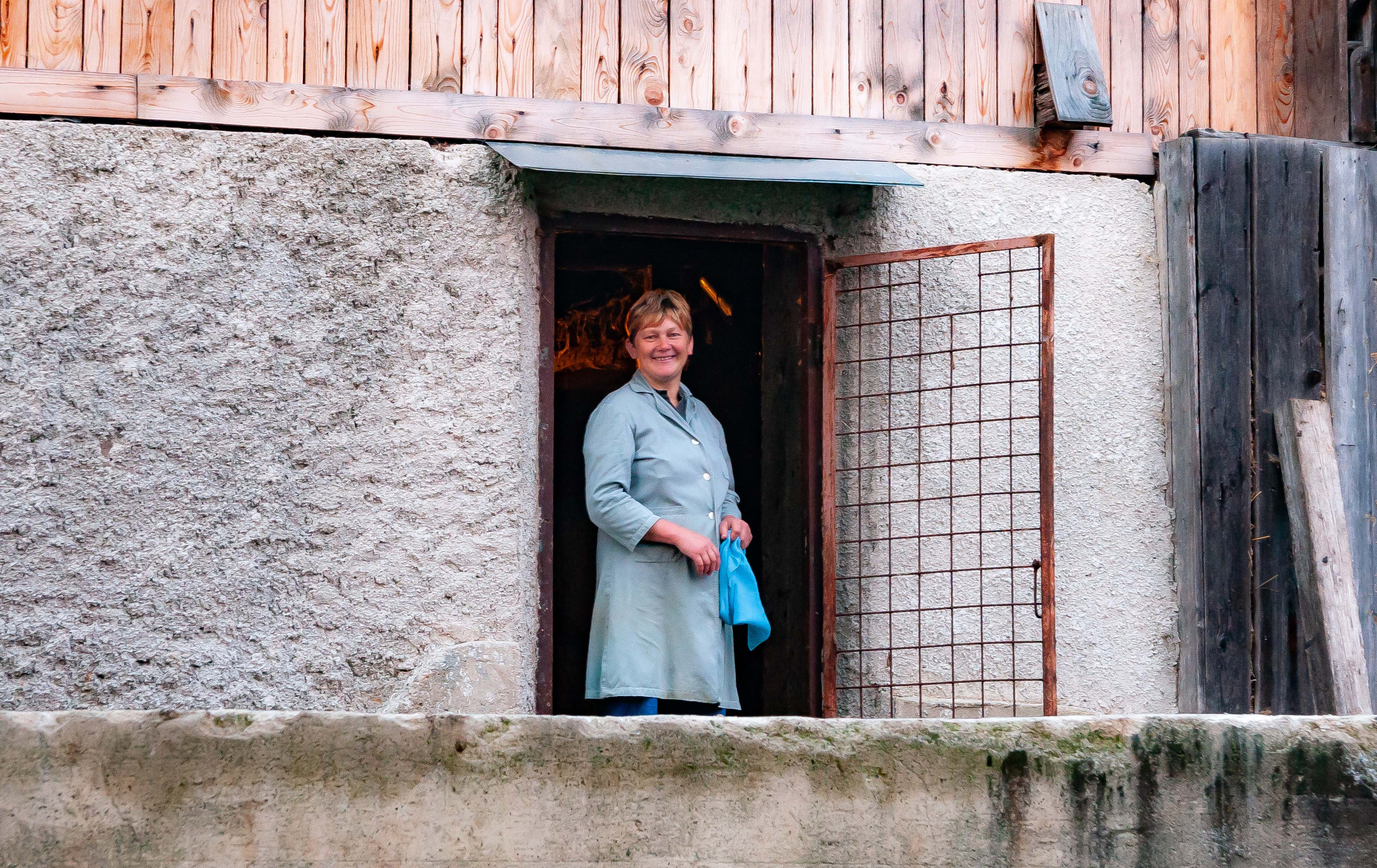 Slovenia, Dobrna Prov, Mother At Door To Stable Under The House, 2006, IMG 8074