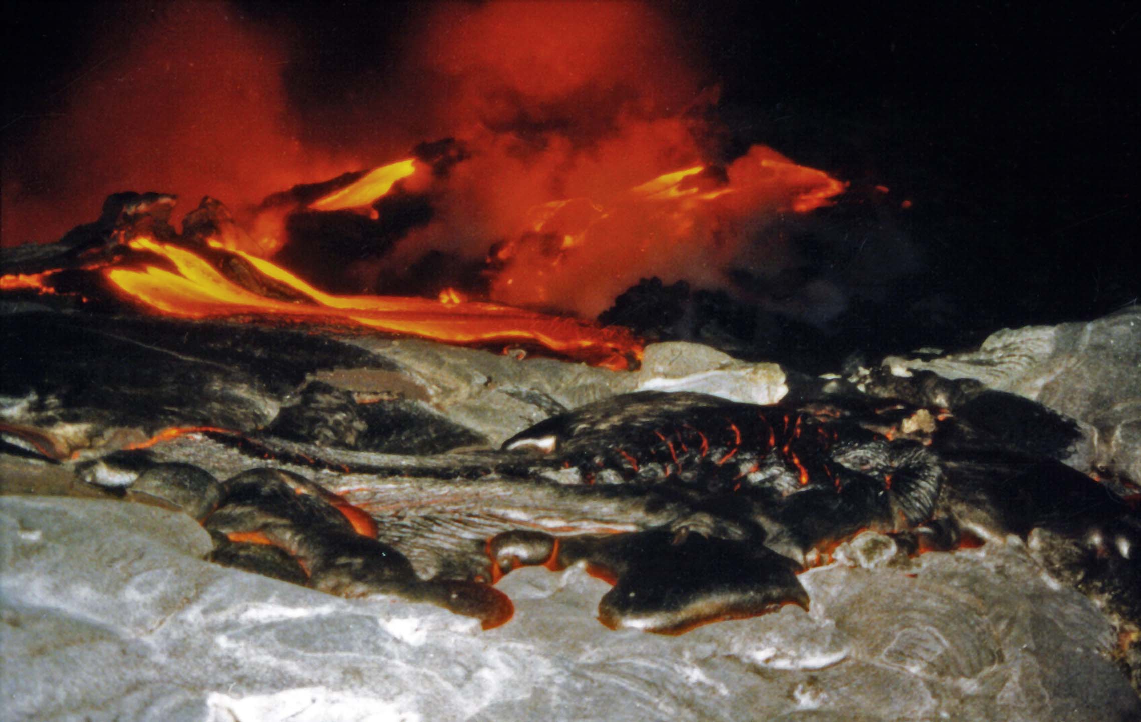 Lava Flow Emanates through Crust of Cooled Lava